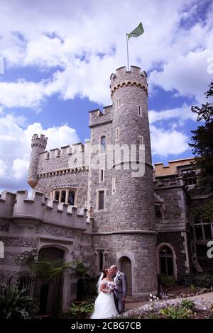 Wedding couple bride and groom kissing at Whitstable Castle (aka Tankerton Towers) wedding venue