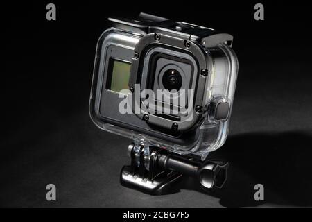action camera in dive housing isolated on black background Stock Photo