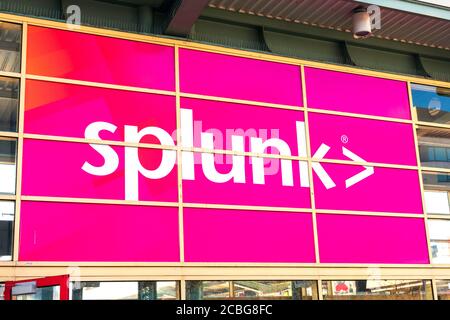 Large Splunk sign on outdoor billboard advertising. Splunk Inc produces software for searching, monitoring, and analyzing machine-generated big data - Stock Photo