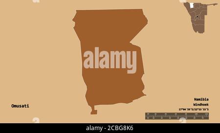 Shape of Omusati, region of Namibia, with its capital isolated on solid background. Distance scale, region preview and labels. Composition of regularl Stock Photo