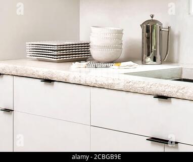 Contemporary White Kitchen with Concrete Countertop Stock Photo