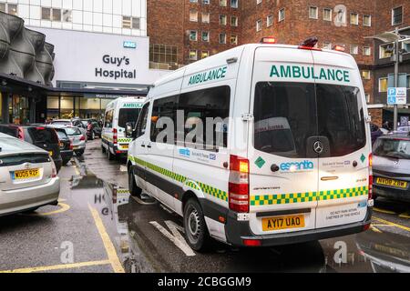 London, United Kingdom - February 01, 2019: Ambulance vans front of Guy's Hospital - one of largest medical / teaching facility of UK capital, founded Stock Photo