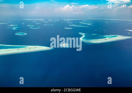 Aerial view of island with coral reef in tropical sea Stock Photo - Alamy