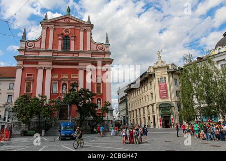 Ljubljana, Slovenia - July 16th 2018: Presernov Trg Square and Cerkev Marijinega oznanjenja or Franciscan church in medieval Ljubljana, Slovenia Stock Photo