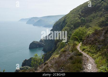 Misty view on a spring morning along the North Devon coast seen from the coast path between Heddon's Mouth and Woody bay.Devon.UK Stock Photo