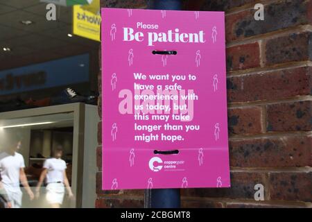 'Be patient' sign on a shopping street in York's Coppergate area.Daily life in Yorkshire, the largest county in England, UK. Stock Photo