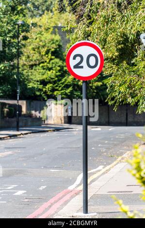 20 mph (Miles Per Hour) British road speed limit sign on residential built up area Stock Photo