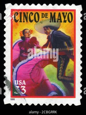 London, UK, February 20 2011 - Vintage 1999 USA cancelled postage stamp showing an image of Mexican Flamenco dancers celebrating Cinco De Mayo Mexico Stock Photo