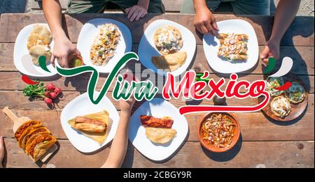 top view of tacos, tamal, enchilada, pozole with the phrase viva mexico Stock Photo