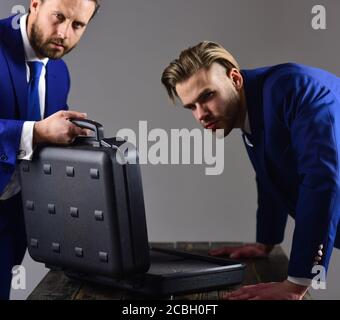 Business exchange concept. Handover of suitcase in hands of part Stock ...