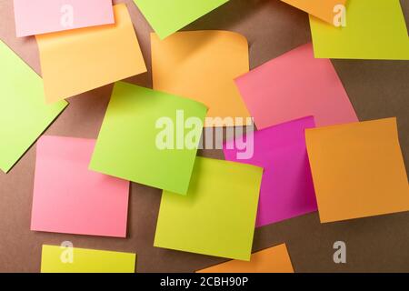 Colorful sticky notes on wall Stock Photo