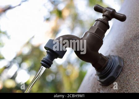 Clear Water Running From Reservoir Tank Tap Stock Photo
