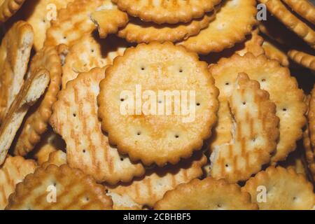 Round crackers background. crispy cookies. pile of biscuits Stock Photo