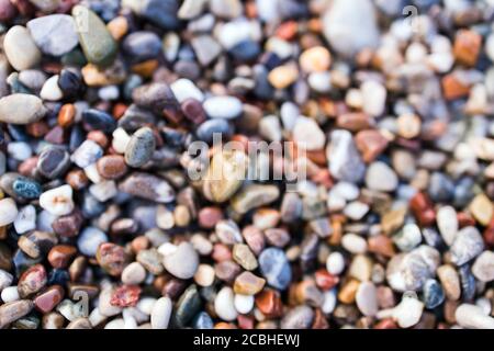 Background of colored sea pebbles on the beach of Alanya, Turkey. Seamless texture Stock Photo