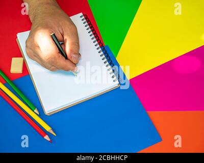 We draw in a notebook with a pencil. Stock Photo