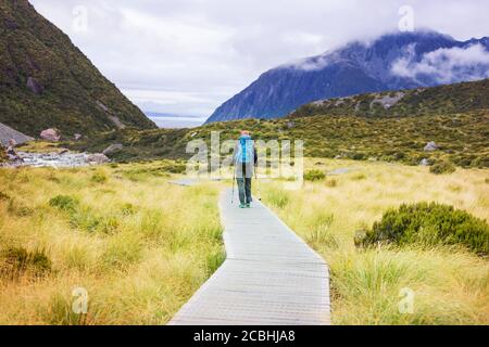 Hiker in beautiful mountains near Mount Cook, New Zealand, South island Stock Photo