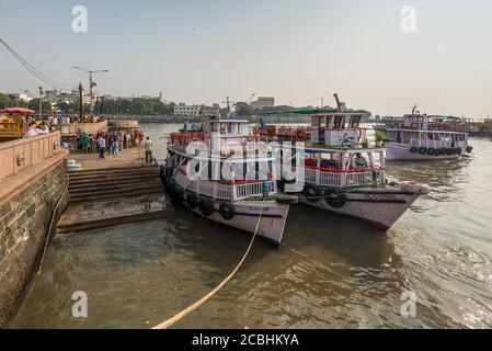 Mumbai, India - November 22, 2019: Colorful tourist passenger boats near Gateway of India in Mumbai (Bombay), India. Stock Photo