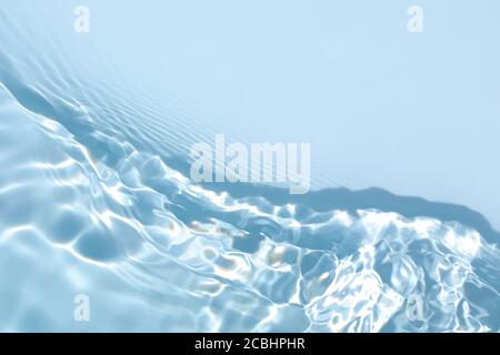 transparent blue colored clear calm water surface texture  Stock Photo