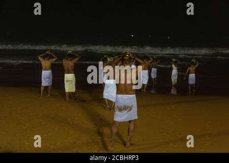 Vavu Bali is an event of paying homage to ancestors. Puja (A ritual) is performed on riverbanks and beaches on the no moon day Stock Photo