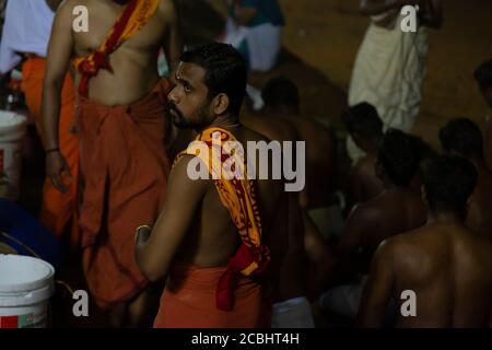 Vavu Bali is an event of paying homage to ancestors. Puja (A ritual) is performed on riverbanks and beaches on the no moon day Stock Photo