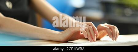 Close up of a woman working on a computer keyboard Stock Photo