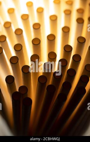 Industrial texture created using paper straws, playing with light Stock Photo