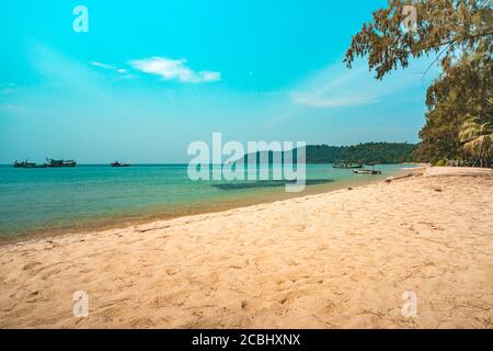 Soft waves of ocean at tropical long sand beach with many footprint on the beautiful island of Koh Rong, Stock Photo