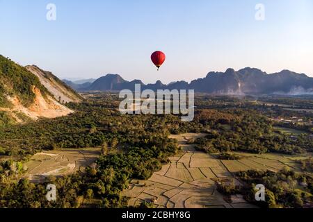 Hot air balloons over karst hills along Nam Song Xong river, Vang Vieng,