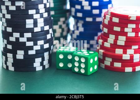 Playing dice and poker chips stacks Stock Photo