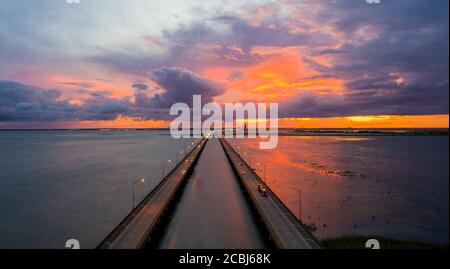 Mobile Bay and interstate 10 bridge at sunset Stock Photo