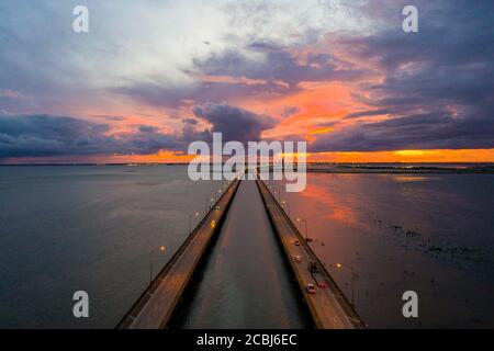 Mobile Bay and interstate 10 bridge at sunset Stock Photo