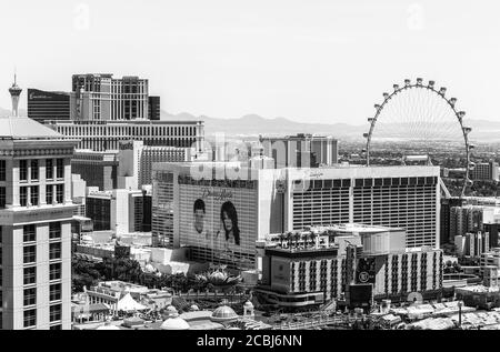 LAS VEGAS, USA - June 7, 2019: Several Hotels and Casinos at the Las Vegas Boulevard with the high roller, hills, and residential buildings in the bac Stock Photo