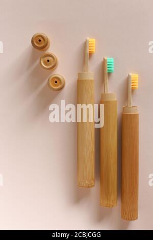 A family set of three wooden toothbrushes on isolated background. Stock Photo