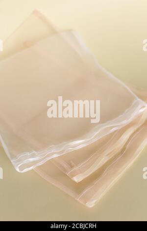 Translukent bags for fruits in light background with copy space. Stock Photo
