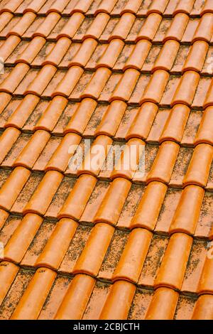 The texture of the orange new tiled roof. Stock Photo