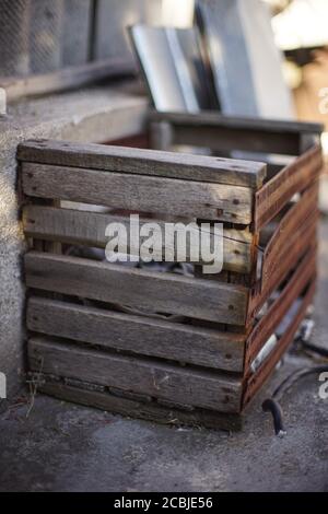 old wooden box with one side made of rusty metal Stock Photo
