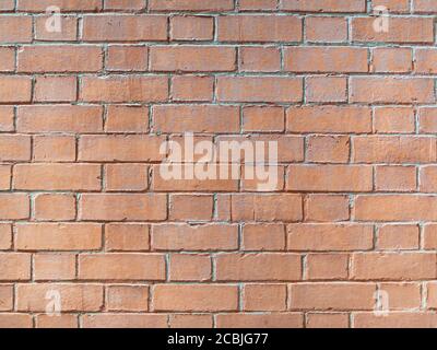 Real orange brick wall background texture. Masonry. Stock Photo