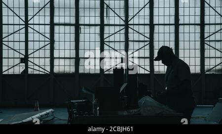 Engineers working on aircraft in aircraft maintenance factory Stock Photo
