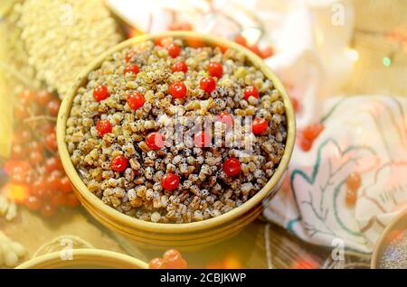 Sweet Christmas dish in rustic clay bowl.Traditional Christmas kutya on the table. Stock Photo