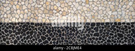 Stone wall design - beige above and black below Stock Photo
