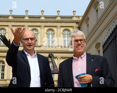 14 August 2020, Brandenburg, Potsdam: Dietmar Woidke (l, SPD), Minister President of Brandenburg, speaks during his press tour at the rear entrance to the Barberini Museum next to Dieter Hütte, Managing Director Tourism Marketing Brandenburg. During the closing phase of the museum, there was a preview of the new exhibition 'Impressionism. The Hasso Plattner Collection', which will open on 07.09.2020. Potsdam should thus become one of the most important centres of collections of impressionist landscape painting worldwide outside of Paris. Photo: Soeren Stache/dpa-Zentralbild/ZB Stock Photo