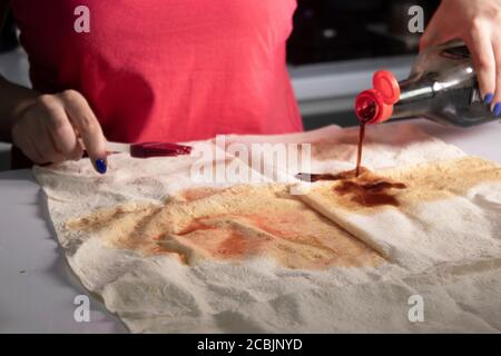 girl's hands prepare pita bread in a gray kitchen on a white table top. cooking process. High quality photo Stock Photo