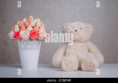 Fruit bouquet decoration with teddy bear toy on the table Stock Photo