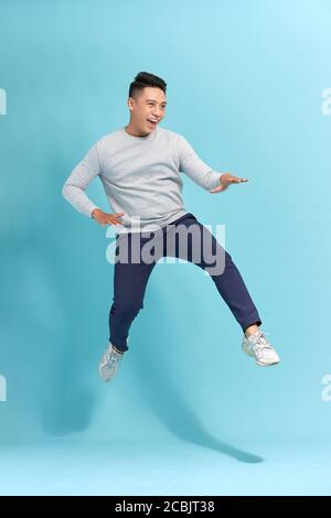 Portrait of attractive trendy hurry move motion energy vacation holiday scream shout crazy isolated blue background Stock Photo