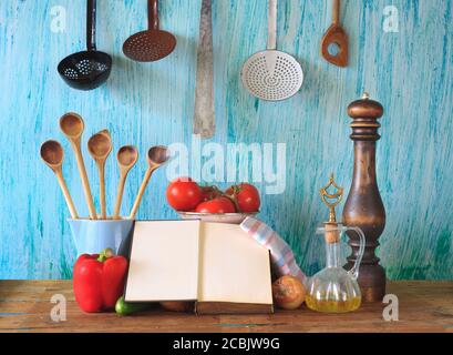 cookbook,old kichen utensils,vegetables, free copy space Stock Photo