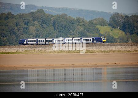 British Rail Class 195 Civity diesel multiple-unit passenger train manufactured by CAF operated by Northern Trains leaves Grange-over-Sands along to c Stock Photo