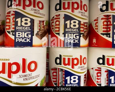 Viersen, Germany - July 9. 2020: View on stack Duplo chocolate bar boxes in shelf of german supermarket (focus on center) Stock Photo