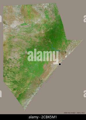 Shape of Jubbada Hoose, region of Somalia, with its capital isolated on a solid color background. Satellite imagery. 3D rendering Stock Photo