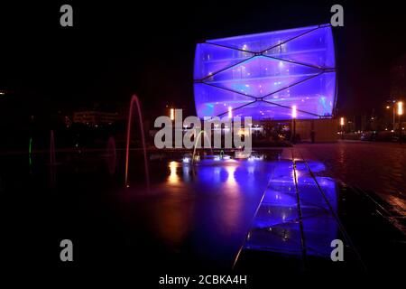 Water Mirror and  Le Nuage building by night designed by Philippe Starck , Parvis Stéphane Hessel, Montpellier, France Stock Photo