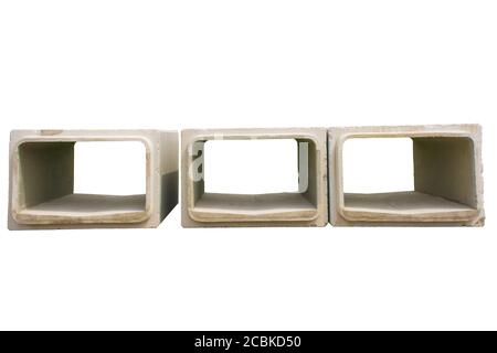 Three reinforced concrete box culverts isolated on a white background. Square pre-cast culverts. Sewage replacement scheme, NE Italy Stock Photo